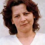 Dada M. (2000)  - Dada M. Born in 1969 in Vlasenica, near Srebrenica. Her husband was killed in the war in 1992. She has a daughter and lives with her “new” family, her partner and his two children, in Tuzla.