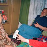 Selma M. (2005)  - My brother-in-law hands over the money that just arrived from America to our mother-in-law. Without this help from outside our live would be difficult.